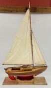 A VINTAGE HAND CRAFTED MODEL POND YACHT & STAND L 69CM.