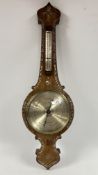A VINTAGE BANJO BAROMETER WITH INLAID MOTHER OF PEARL DETAIL.