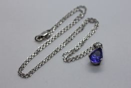 A TANZANITE AND DIAMOND PENDANT NECKLACE,