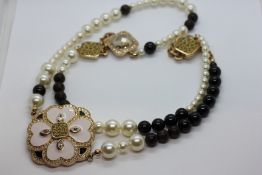 A BOXED CHRISTIAN DIOR DESIGNER NECKLACE.