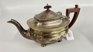A SILVER TEAPOT,