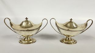 A PAIR OF ANTIQUE SILVER SAUCE TUREENS, LONDON 1903 - 1905 MAKER C.S. HARRIS L 21.5CM X H 14CM.