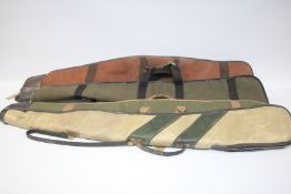 4 ASSORTED GUN SLIPS INCLUDING CANVAS EXAMPLES.