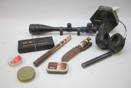 A GROUP OF SHOOTING ACCESSORIES TO INCLUDE TASCO 6-24X50 AOE SCOPE WITH MOUNTS, LASER BORE SIGHTER,