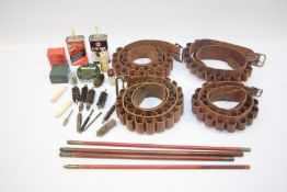 A GROUP OF SHOTGUN CLEANING ACCESSORIES TO INCLUDE RODS, PATCHES, BRUSHES PLUS FOUR CARTRIDGE BELTS.