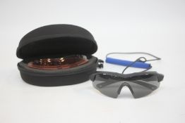 A PAIR OF CASED AS NEW BLU EYE SHOOTING GLASSES.