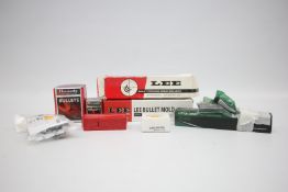 A GROUP OF RELOADING ACCESSORIES AND EQUIPMENT TO INCLUDE HORNADY 35 CAL GAS CHECKS FOR CAST