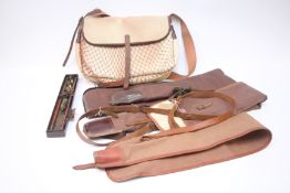 A GROUP OF SHOOTING ACCESSORIES TO INCLUDE GAME BAG, GUN SLEEVES, CLEANING KIT.