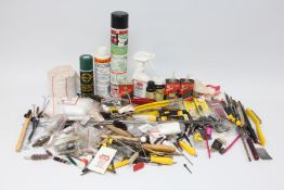 BOX CONTAINING QUANTITY RIFLE AND SHOTGUN CLEANING RODS, BRUSHES AND LUBRICANTS.