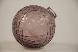 A LATE VICTORIAN GLASS TARGET BALL WITH MOULDED STANDING SHOOTER.