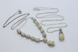 TWO MODERN SILVER AND OPAL NECKLACES TO INCLUDE A PENDANT EXAMPLE.