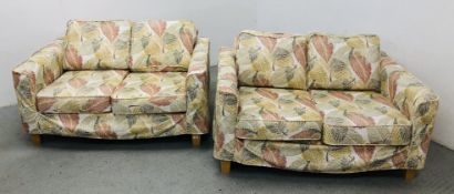 A PAIR OF MODERN TWO SEATER SOFA'S WITH LOOSE COVERS (ORIGINAL COVERINGS AND LOOSE COVERS