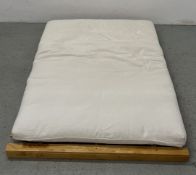 A MODERN FUTON BED, BEECHWOOD FRAMED.