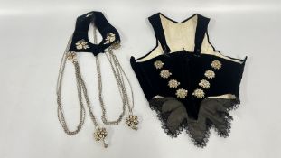 A VINTAGE BLACK VELVET CORSET AND COLLAR WITH WHITE METAL DECORATIVE CHAINS AND FILIGREE CLASPS.