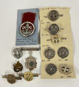 A SMALL GROUP OF BOY SCOUT ASSOCIATED MEDALLIONS AND BADGES INCLUDING SILVER.