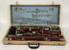 VINTAGE LARK BASSOON IN NEED OF RESTORATION, IN VINTAGE CARRY CASE.