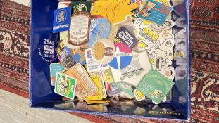A LARGE BOX CONTAINING AN EXTENSIVE GROUP OF VINTAGE BEER MATS.