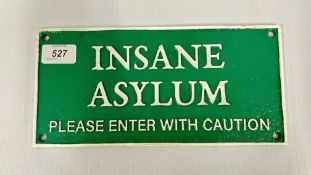 METAL 'INSANE ASYLUM' WALL PLAQUE.