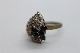 9CT DIAMOND CHIP AND BLUE SET RING.