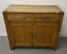 A MODERN SOLID LIGHT OAK TWO DRAWER, TWO DOOR SIDEBOARD, W 97 X D 45 X H 86CM.