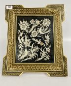 A HANDCRAFTED PERSIAN STYLE FRAME FEATURING A SILVER PLATED ON COPPER PANEL DEPICTING A BIRD AND