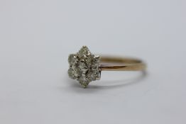 LADIES 9CT DIAMOND SET FLOWER HEAD RING MARKED 375.