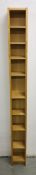 A MODERN BEECH WOOD FINISH TOWER FLOOR STANDING MEDIA SHELF UNIT.