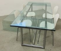 A LARGE DESIGNER EXTENDING GLASS TOP DINING TABLE ON CHROME SUPPORTS WITH A SET OF 4 DESIGNER