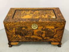 AN ORIENTAL HEAVILY CARVED CAMPHOR WOOD TRUNK, W 101 X D 53 X H 60CM.