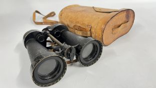 A PAIR OF VINTAGE MILITARY BINOCULARS MARKED 