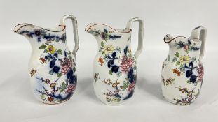 A SET OF THREE GRADUATED DAVENPORT JUGS.