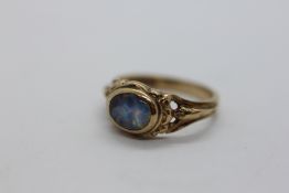 A LADIES 9CT GOLD AND OPAL SET RING SIZE K/L.
