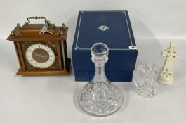 AN EDINBURGH CRYSTAL BOXED DECANTER WATERFORD GLASS ANGEL, BELLEEK CROSS AND A MANTEL CLOCK.