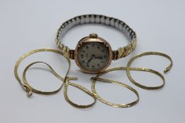 A VINTAGE 9CT GOLD CASED WRIST WATCH MARKED 