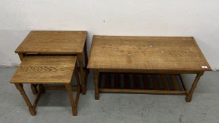 A NEST OF TWO GRADUATED OAK OCCASIONAL TABLES AND AN OAK TWO TIER RECTANGULAR COFFEE TABLE.