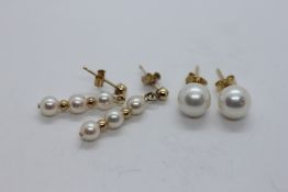 A PAIR OF 18CT GOLD PEARL STUD EARRINGS + A PAIR OF 9CT GOLD PEARL DROP EARRINGS.