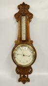 A CARVED OAK BAROMETER.