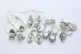8 PAIRS OF SILVER EARRINGS.
