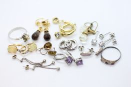 10 PAIRS OF SILVER EARRINGS PLUS TWO SILVER DRESS RINGS.