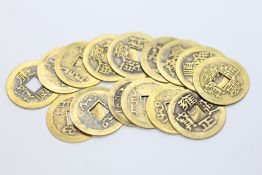 A GROUP OF 15 ORIENTAL GILT TOKENS.