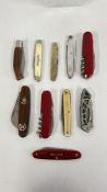 A GROUP OF 10 ASSORTED POCKET KNIVES, HORN, SWISS AND MULTI TOOL EXAMPLES.