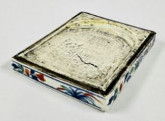 A CHINESE PORCELAIN BASE SECTION OF AN INKSTONE, BEARS A WANLI MARK TO UNDERSIDE.