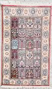 A PERSIAN QUM STYLE RUG, 132 X 77CM.