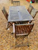 WOODEN GARDEN TABLE WITH FIVE MATCHING FOLDING WOODEN CHAIRS.
