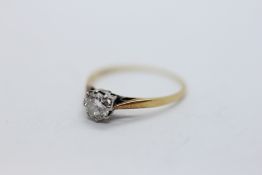 A SOLITAIRE DIAMOND RING, THE SHANK HEAVILY WORN, ASSUMED 18CT,
