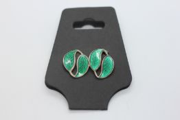 A PAIR OF DESIGNER DAVID ANDERSEN NORWEGIAN SILVER AND ENAMEL CLIP ON GREEN LEAF EARRINGS.