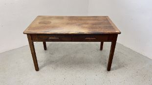 A VINTAGE TWO DRAWER OAK DESK.