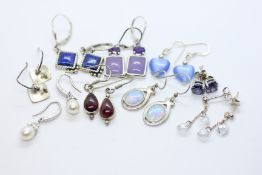 9 PAIRS OF SILVER EARRINGS.