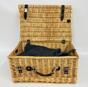 A WICKER PICNIC BASKET CONTAINING VARIOUS RAF UNIFORM.