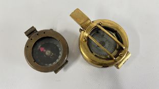 TWO VINTAGE MILITARY COMPASSES TO INCLUDE A BRASS CASED EXAMPLE.